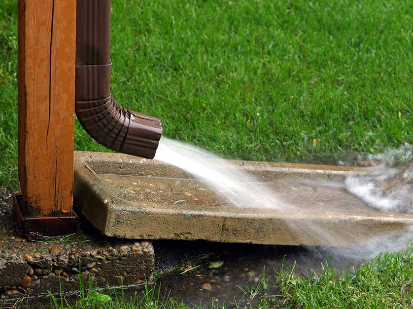How Splash Blocks and Downspout Extensions Save Your Yard
